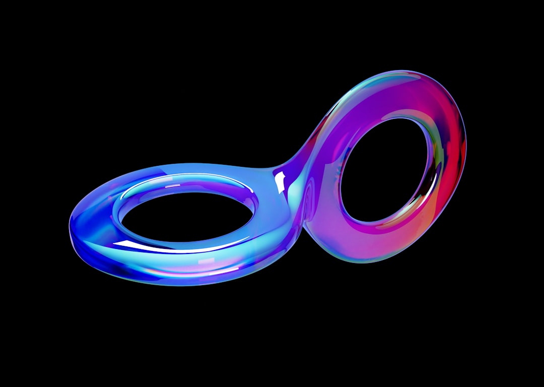 A glossy iridescent figure-eight loop sculpture floating on a black background, representing infinite feedback cycles